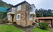 Casa de piedra con vistas al mar en doniños