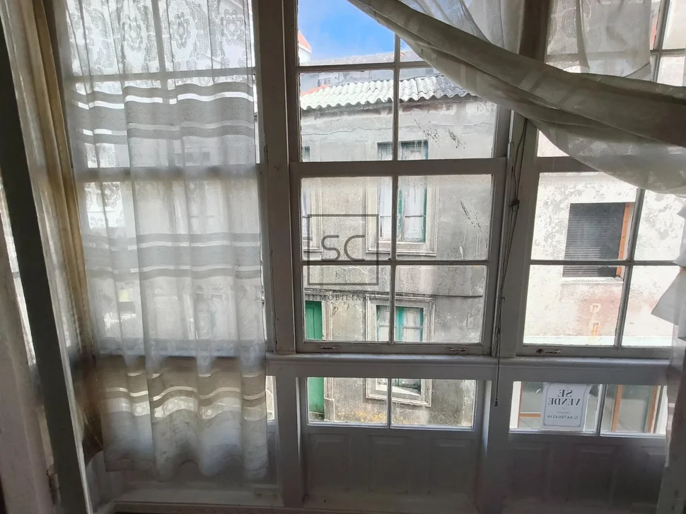 Casa adosada en el centro de Cariño.