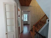 Casa adosada en el centro de Cariño.